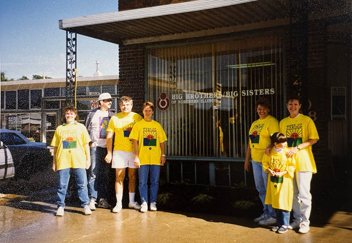 Week of Caring volunteers pose outside Big Brothers/Big Sisters, 1990s
