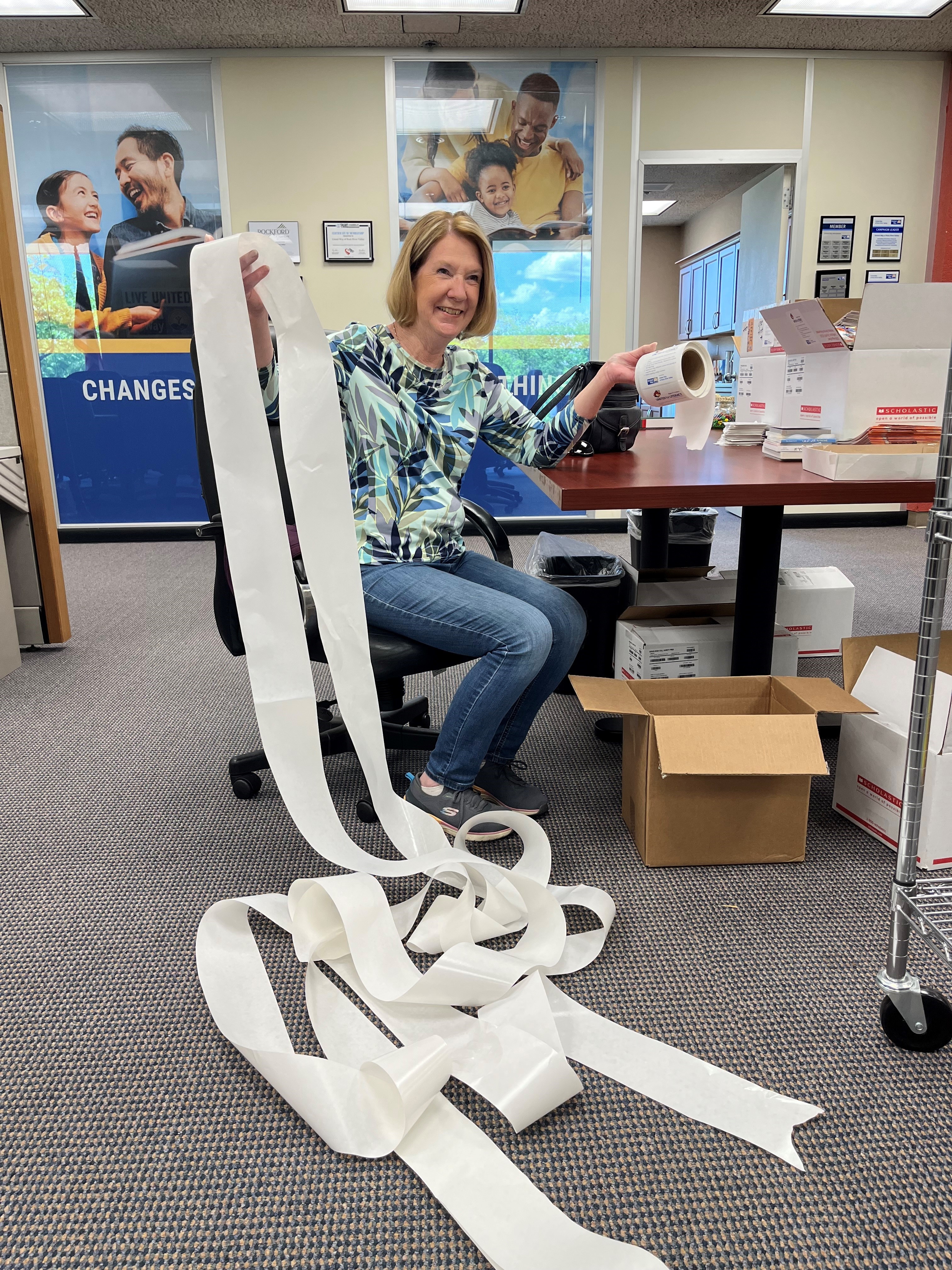 Office volunteer Deb showing off her stickering record