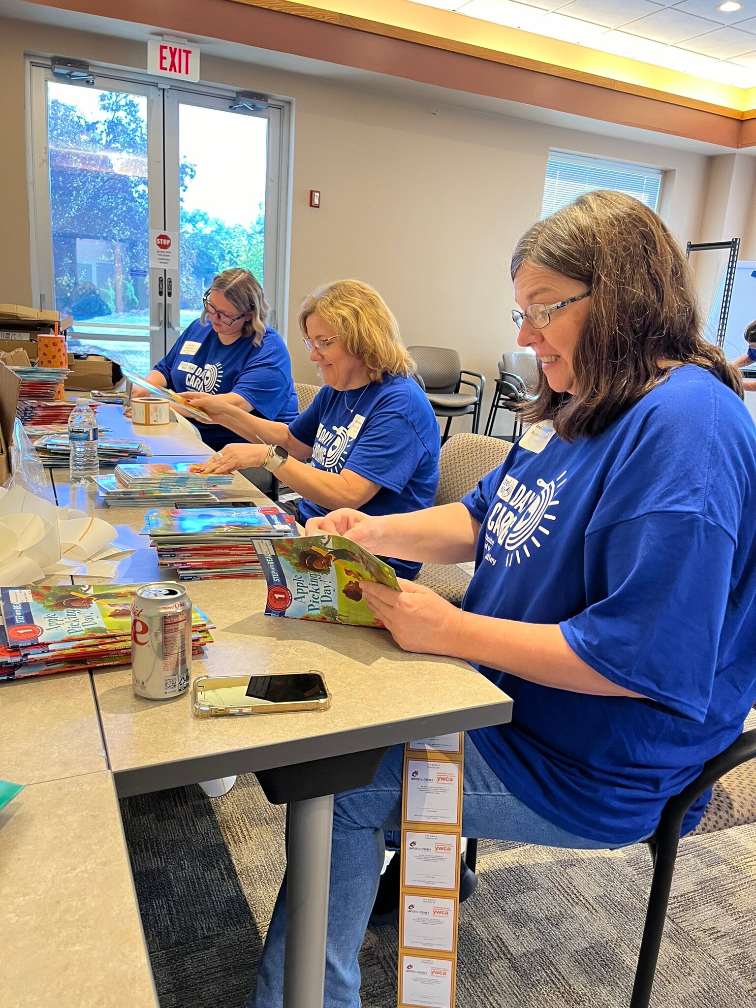 volunteers sorting books at the YWCA