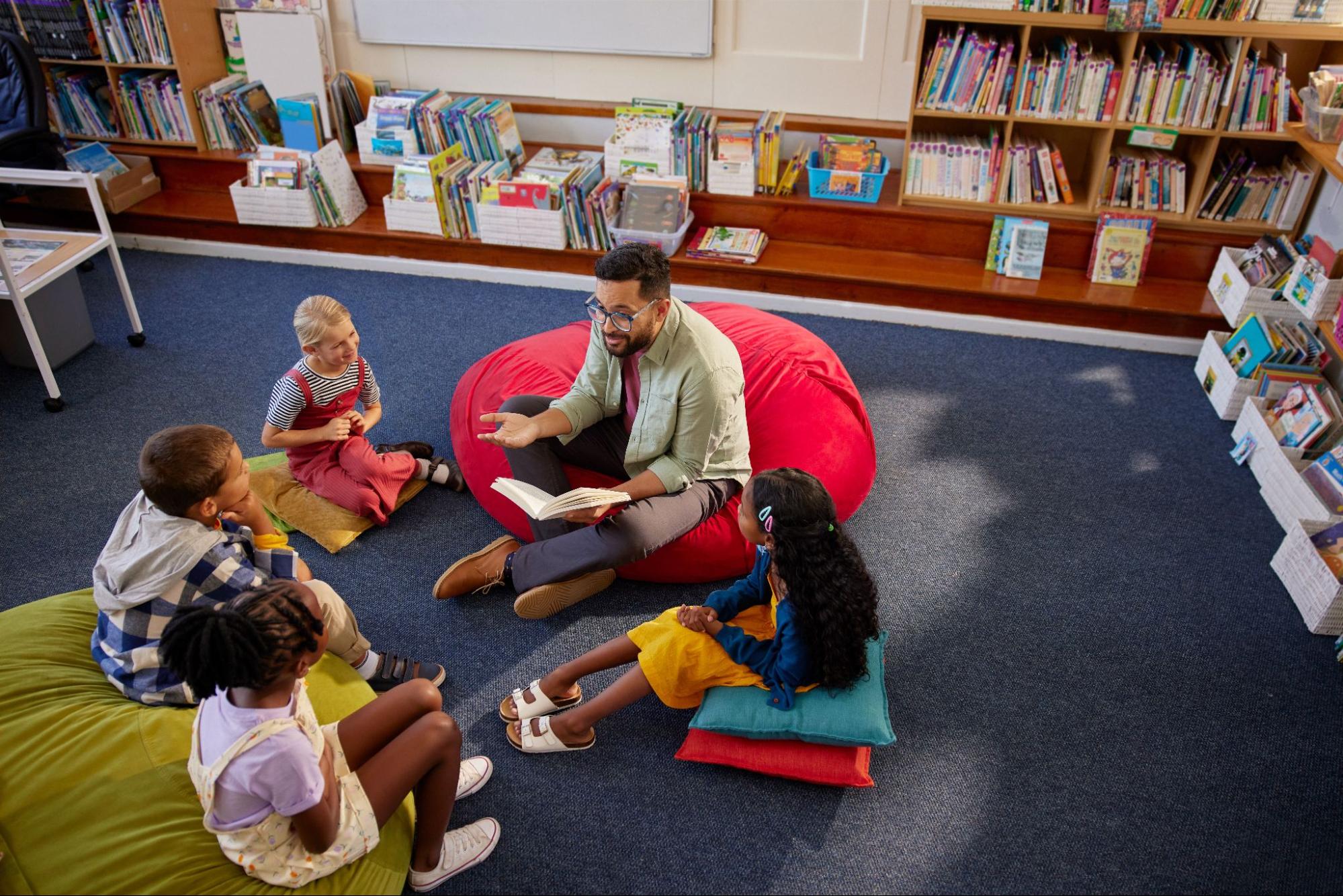man reading to children