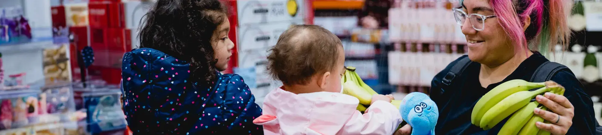 mother and children at grocery store