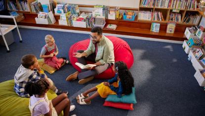 Teacher reading to kids and nurturing early literacy